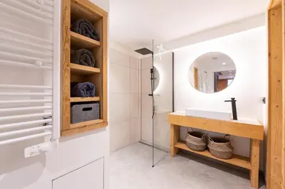 a bathroom with a sink and a mirror at Chalet Croc Blanc, Chamonix - vu massif exceptionnel in Les Houches