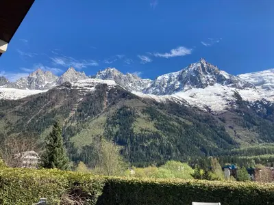 a view of a mountain range with snow covered mountains at Chamonix Centre - Sophisticated 2-Bedroom Duplex in Chamonix-Mont-Blanc