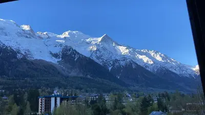 a view of a mountain range with snow covered mountains at Chamonix Centre - Sophisticated 2-Bedroom Duplex in Chamonix-Mont-Blanc