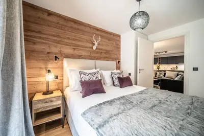 a living room with a couch and a window at Apartment Aubretia, Les Houches - by EMERALD STAY in Les Houches
