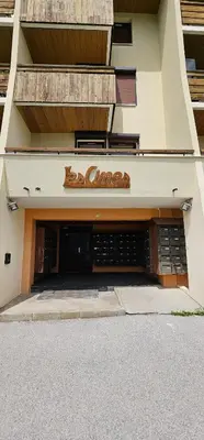 a building with a sign on the side of it at Appartement 4 personnes Samoëns 1600 in Samoëns