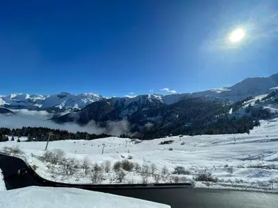 a view of a snow covered mountain with a river at Appartement 4 personnes Samoëns 1600 in Samoëns