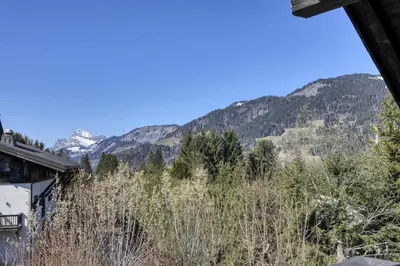 a view of the mountains from a house at Chalet Boucle in Megève
