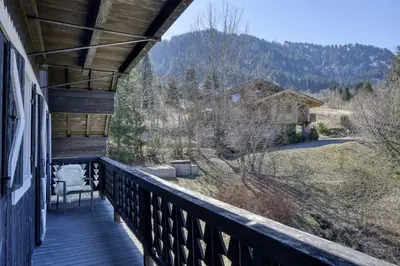 a porch of a house with a view of a mountain at Chalet Boucle in Megève