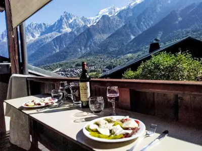 a house with a view of a mountain at Apartment Les Grands Balcons by Interhome in Les Houches