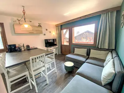 a living room with a couch and a table at Apartment Les Grands Balcons by Interhome in Les Houches