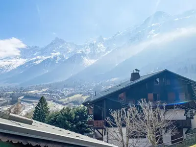 a view of a snowy mountain range from a building at Apartment Les Grands Balcons by Interhome in Les Houches