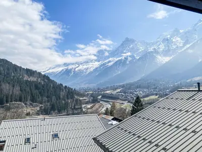 a view of a snowy mountain range from a building at Apartment Les Grands Balcons by Interhome in Les Houches