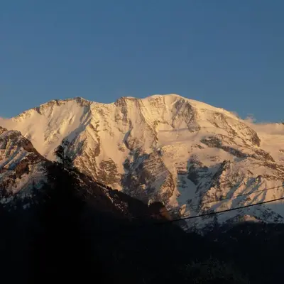 a mountain covered in snow on a clear day at LES JARDINS ALPINS CHEZ Olivier in Saint-Gervais-les-Bains