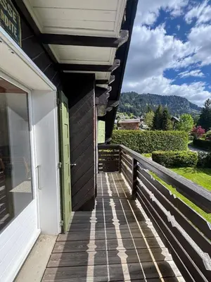 a porch of a house with a door at Megève 4 seasons apartment in Megève