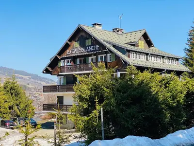 a large building on top of a mountain at Megève 4 seasons apartment in Megève