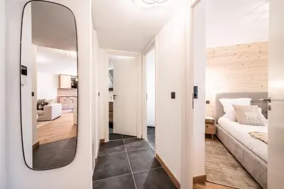 a mirror in a living room with a couch at Apartment Camox, Les Houches - by EMERALD STAY in Les Houches
