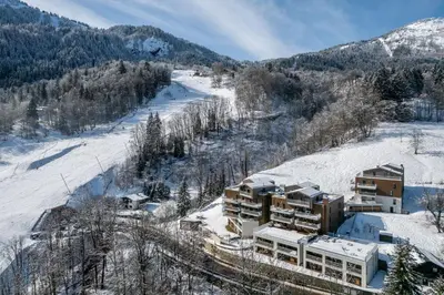 an aerial view of a resort in the snow at Apartment Camox, Les Houches - by EMERALD STAY in Les Houches