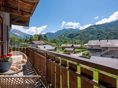 a balcony with a view of the mountains at TigerLily, Samoens in Samoëns