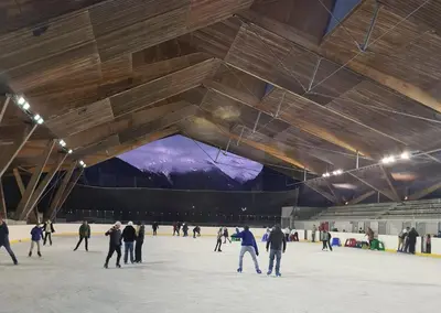 a group of people skating on an ice rink at TigerLily, Samoens in Samoëns