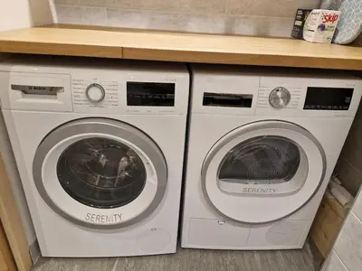 two washing machines are sitting next to each other at TigerLily, Samoens in Samoëns