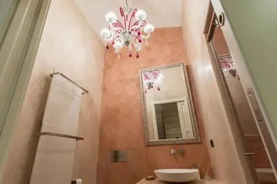 a bathroom with a sink and a mirror at Elegant 3 Bedroom Apartment, Central Chamonix in Chamonix-Mont-Blanc