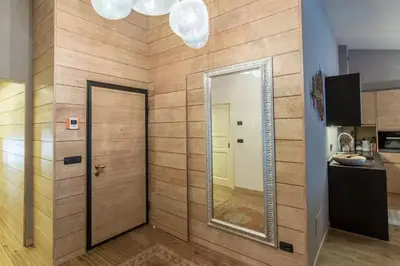 a mirror on a wall in a bathroom at Elegant 3 Bedroom Apartment, Central Chamonix in Chamonix-Mont-Blanc