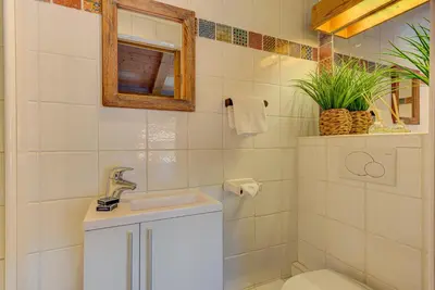 a bathroom with a toilet and a sink and a mirror at Apartment Soleil, Alpes Travel, Argentière, Sleeps 9 in Chamonix-Mont-Blanc