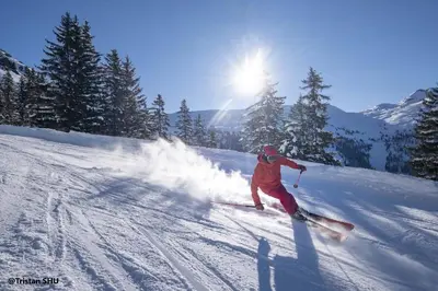 a person is skiing down a snow covered slope at ROUS02 Appartement 6 8 personnes au centre station in Les Carroz d'Araches