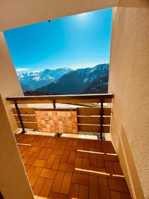 a balcony with a view of the mountains at Samoëns 1600 au pied des pistes in Samoëns
