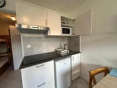 a living room with a couch in a kitchen at Studio rénové pour 4 pers, animaux admis - FR-1-642-103 in Morillon
