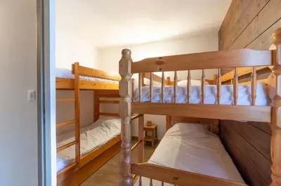 a couple of bunk beds in a room at Cabana & Alp'évasion - Pools, Sauna, Pool Table in Samoëns