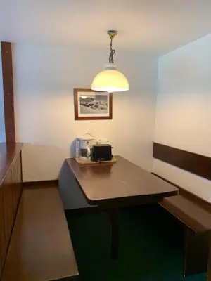 a room with a table with a coffee maker on it at Mont arbois megeve in Megève