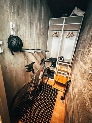 a bike parked in a room with a mirror at Le Montenvers - Central Studio & Private parking in Chamonix-Mont-Blanc