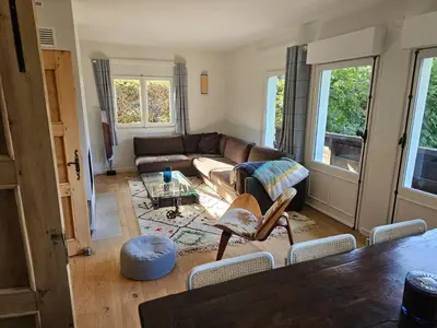 a living room with a couch and a table at Rouge-Gorge, Appartement de charme, 3 chambres, Megève - Rochebrune in Megève