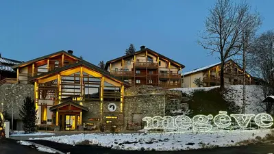 a large house with a bench in the snow at Luxury Penthouse With Mont Blanc Views In Megève in Megève