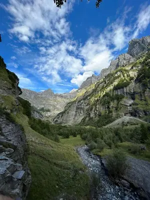 a view of a mountain valley with a river at Chalet des Cimes in Samoëns