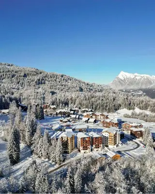 an aerial view of a resort in the snow at Le LODGE Les Esserts 1100 Morillon in Morillon