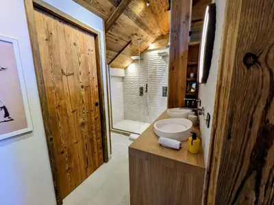a bathroom with a sink and a toilet in a room at Appartement Nuage, Luxe, centre village Megève in Megève