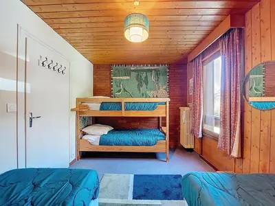 a room with two bunk beds and a window at Apartment Résidence Les Tines by Interhome in Chamonix-Mont-Blanc
