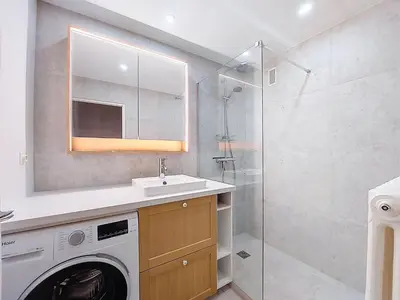 a bathroom with a washing machine and a shower at Apartment Résidence Les Tines by Interhome in Chamonix-Mont-Blanc