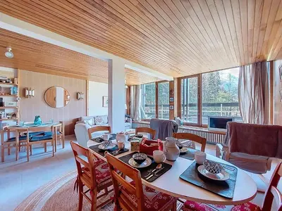 a dining room with a table and chairs in a room at Apartment Résidence Les Tines by Interhome in Chamonix-Mont-Blanc
