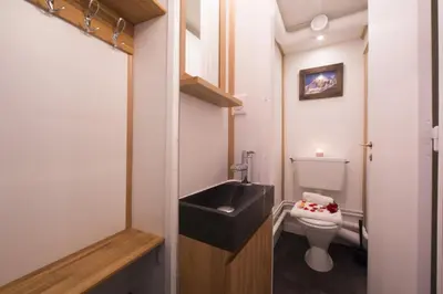 a small bathroom with a sink and a toilet at Résidence Grand Roc - Campanules 112 - Happy Rentals in Chamonix-Mont-Blanc
