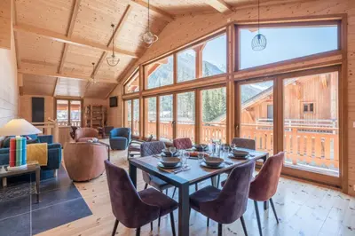 a dining room with a table and chairs at Large chalet for 10 with beautiful garden in Chamonix-Mont-Blanc