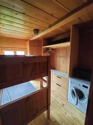 a small cabin with a washing machine in it at Chalet Peppa in Sallanches