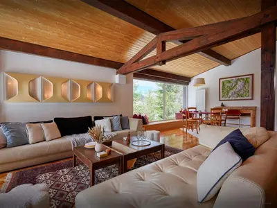 a living room with a couch and a table at Chalet Jorat - OVO Network in Les Contamines-Montjoie