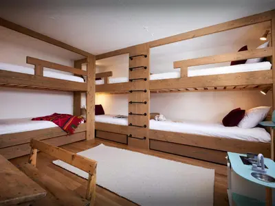 a room with two bunk beds and a desk at Chalet Jorat - OVO Network in Les Contamines-Montjoie