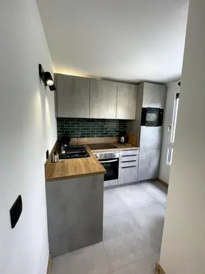 a kitchen with a sink and a stove at NEW Lac Chavants apartment - 4 beds in Les Houches