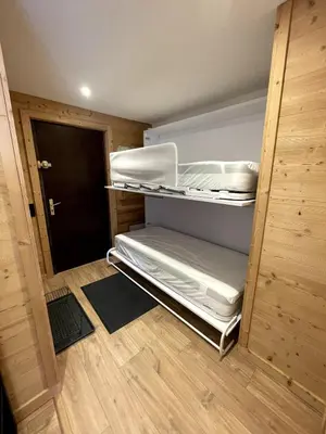 a small room with an empty bunk bed in it at NEW Lac Chavants apartment - 4 beds in Les Houches