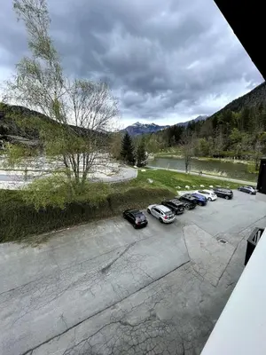a group of cars parked in a parking lot at NEW Lac Chavants apartment - 4 beds in Les Houches