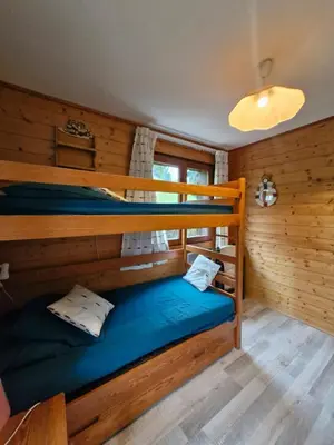 a room with two bunk beds in a cabin at Apartment with garden in Demi-Quartier in Demi-Quartier