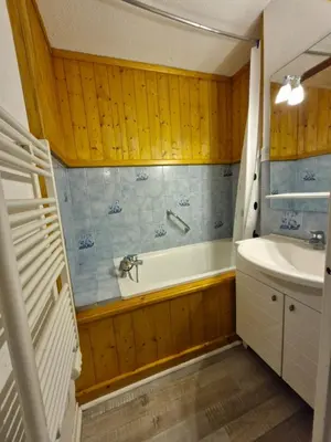 a bathroom with a tub and a sink at Apartment with garden in Demi-Quartier in Demi-Quartier