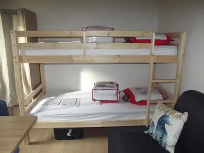 a couple of bunk beds in a room at studio familial 4 couchages in Arâches-la-Frasse