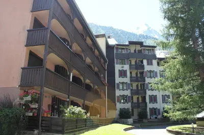 a large building with balconies on the side of it at Apartment Jonquille 3 - A Comfortable Chamonix Haven in Chamonix-Mont-Blanc