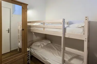 a couple of bunk beds in a room at Apartment Jonquille 3 - A Comfortable Chamonix Haven in Chamonix-Mont-Blanc